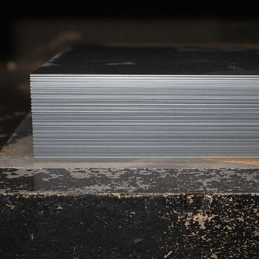 Unmarked metal stock on a workshop surface, used only as a generic reference image.
